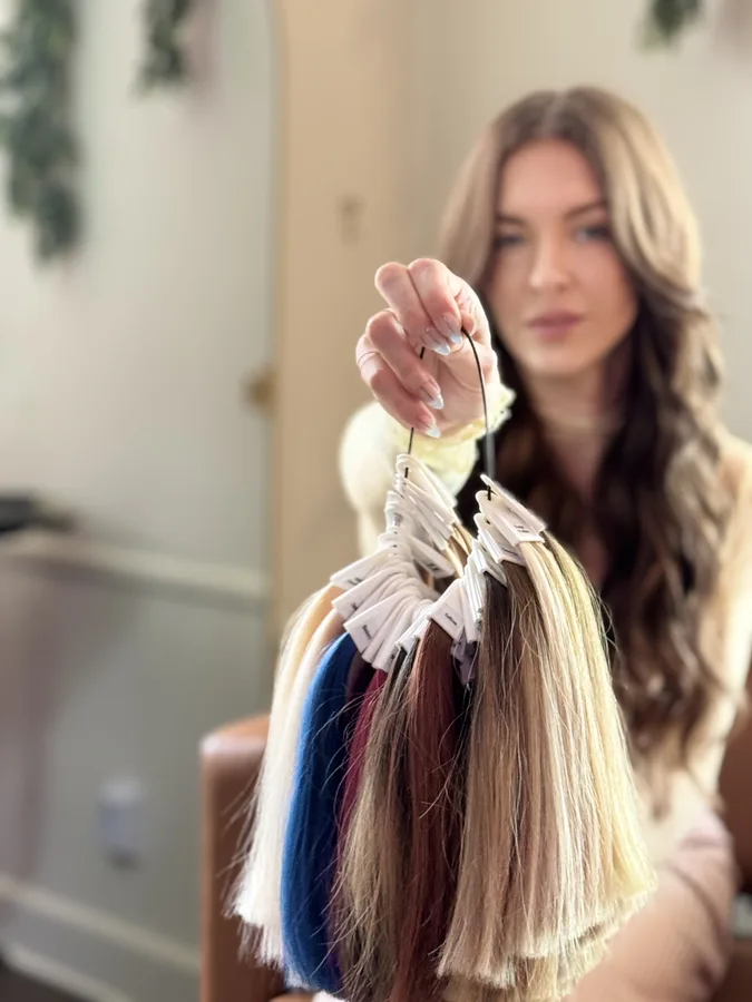 Hand-tied weft color ring held up for a match